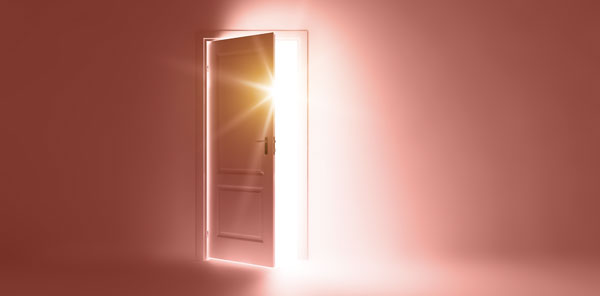 An open door with bright light shining through.